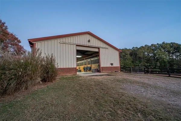 an aerial view of a house with outdoor space