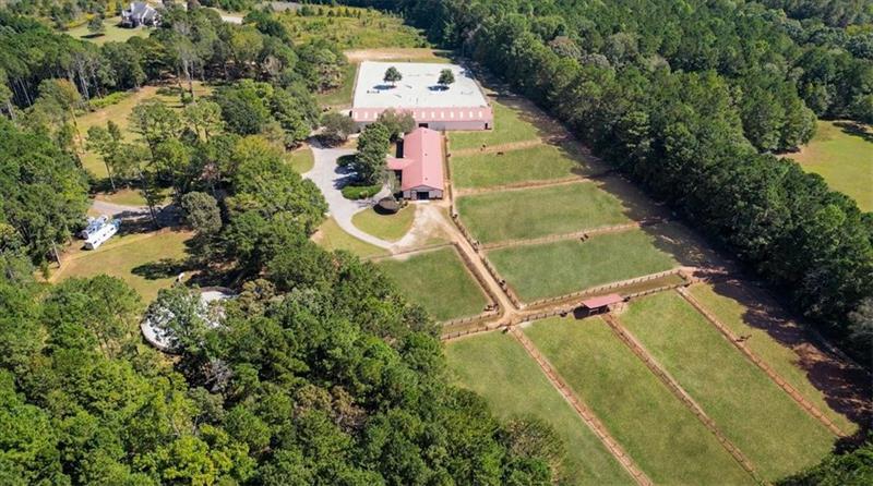 3055 A Spring Hill Drive Monroe, GA 30656 - Photo 5 of 65 an aerial view of a house with a yard and trees