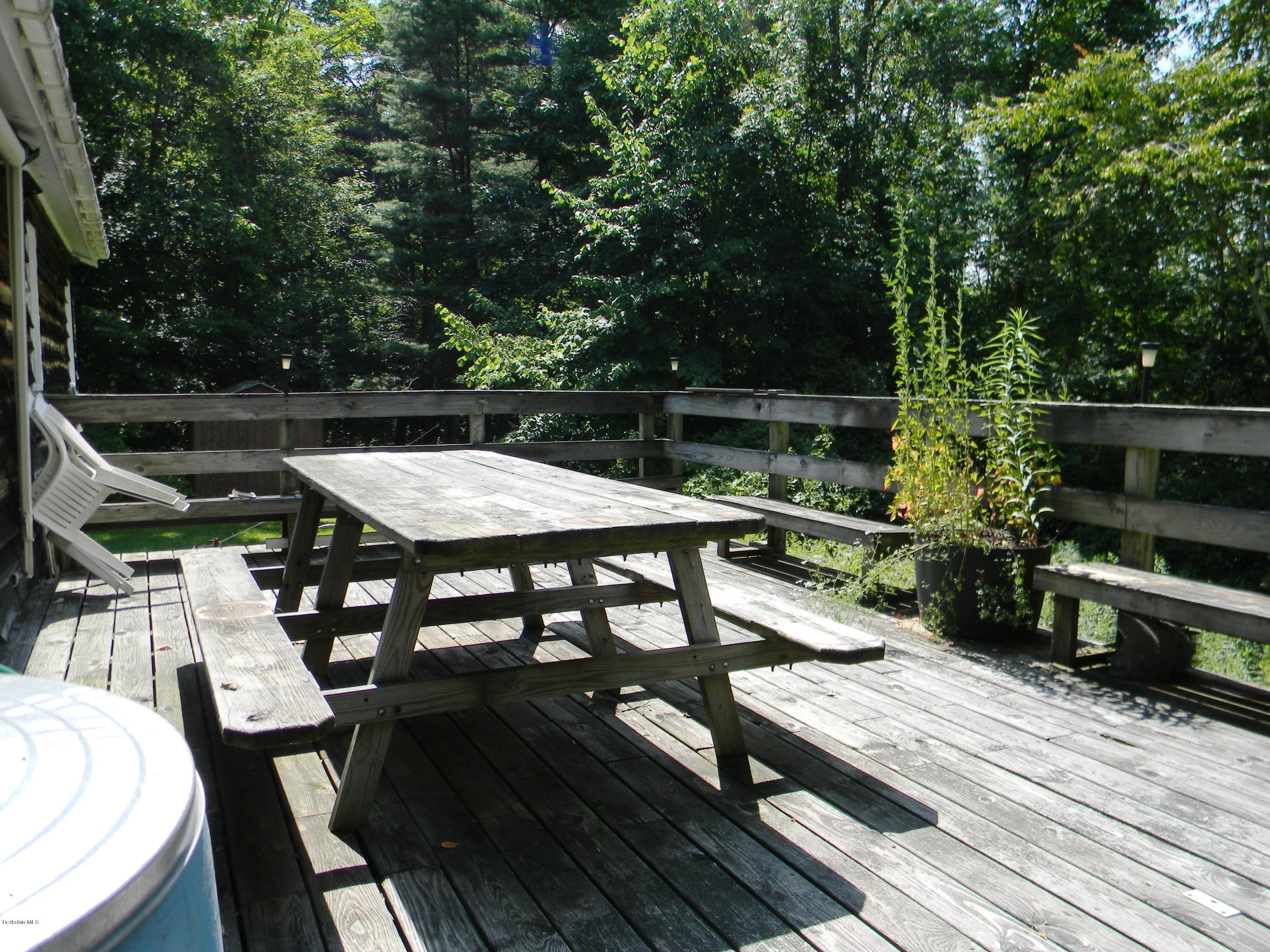 59 Oak Road Richmond, MA 01201 - Photo 8 of 11 a view of a dinning tables and chairs in the balcony