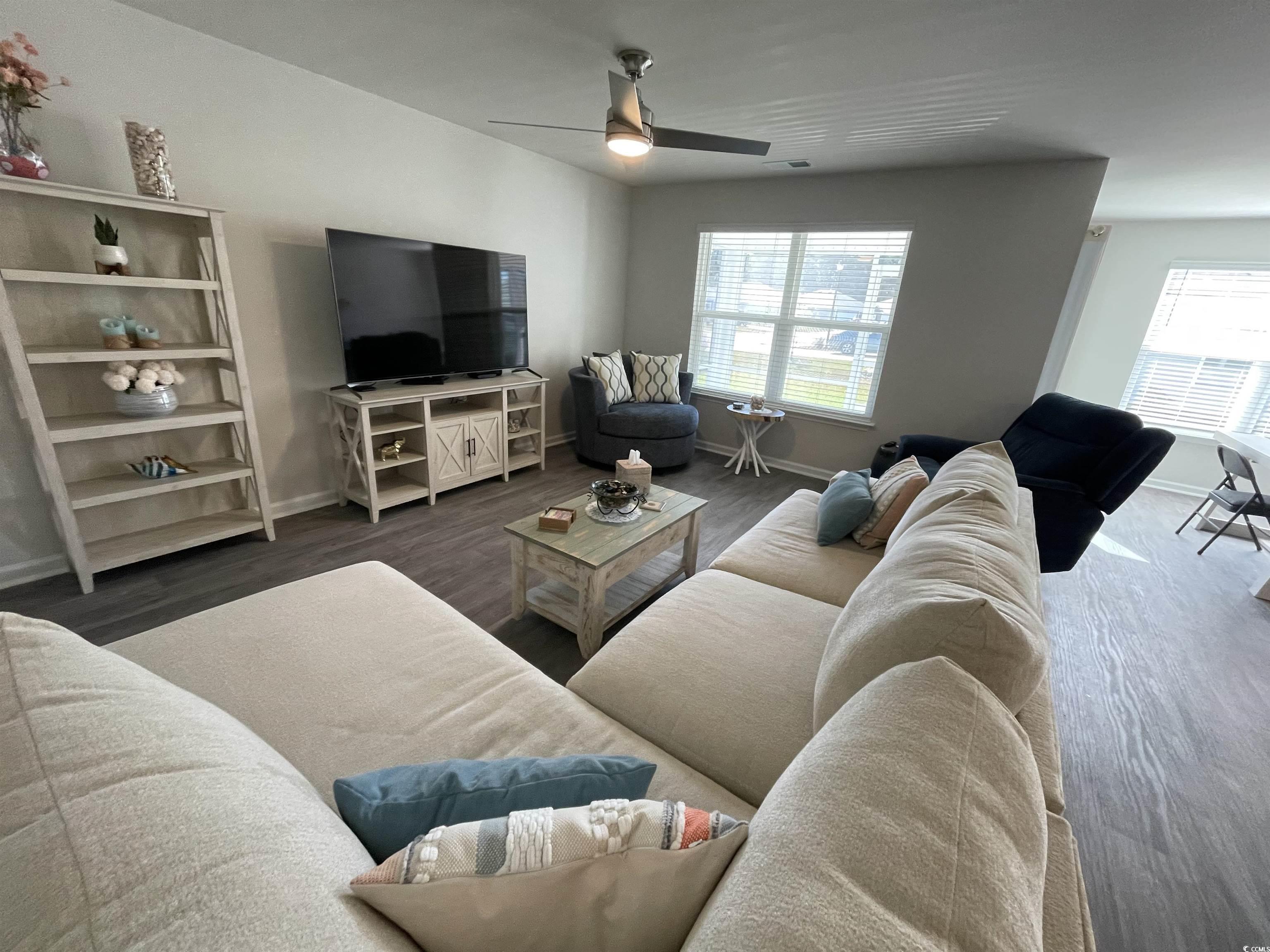 351 Jeff Waters Circle Longs, SC 29568 - Photo 11 of 33 Living area featuring wood finished floors and ceiling fan