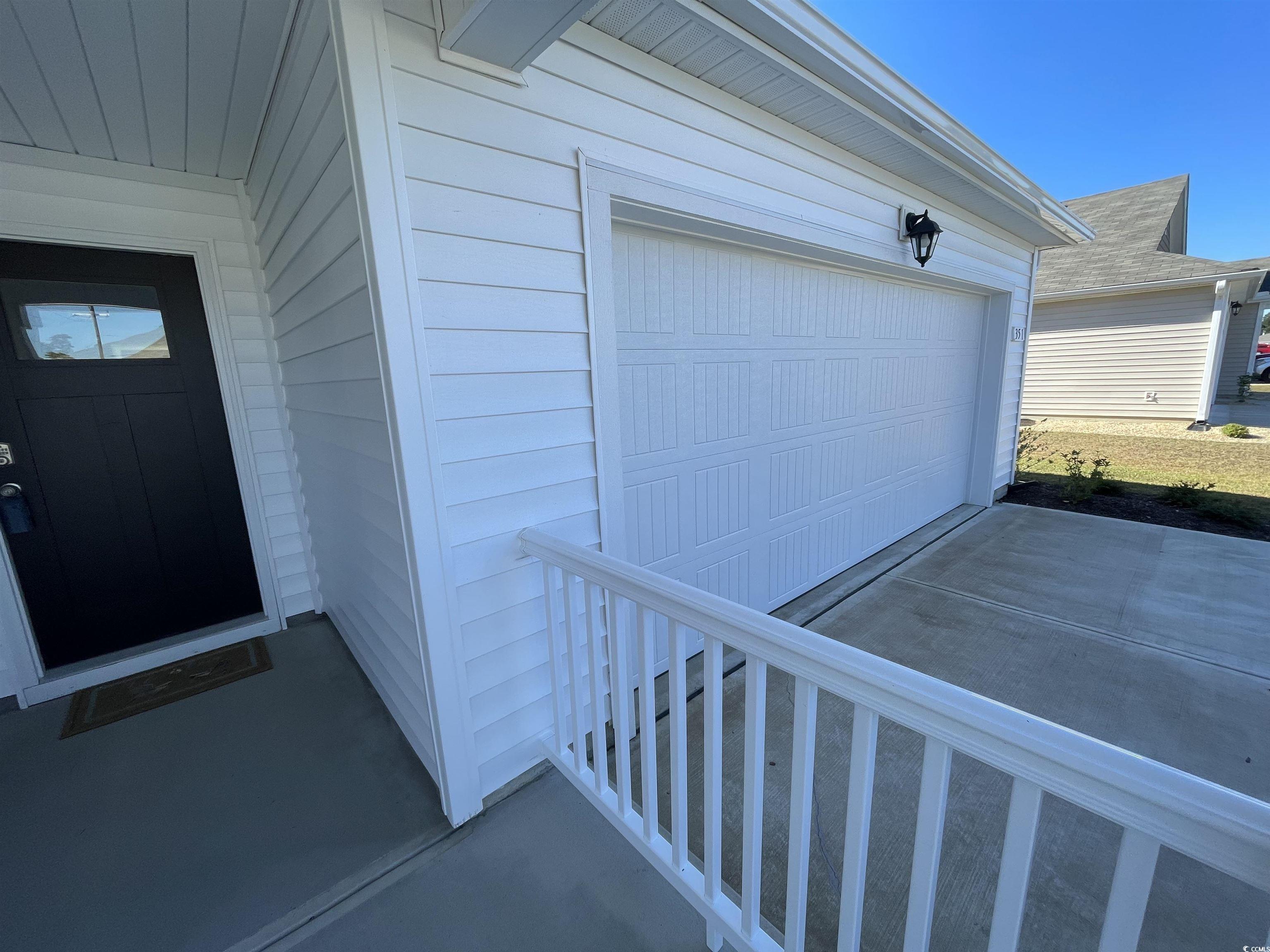 351 Jeff Waters Circle Longs, SC 29568 - Photo 2 of 33 Garage with concrete driveway