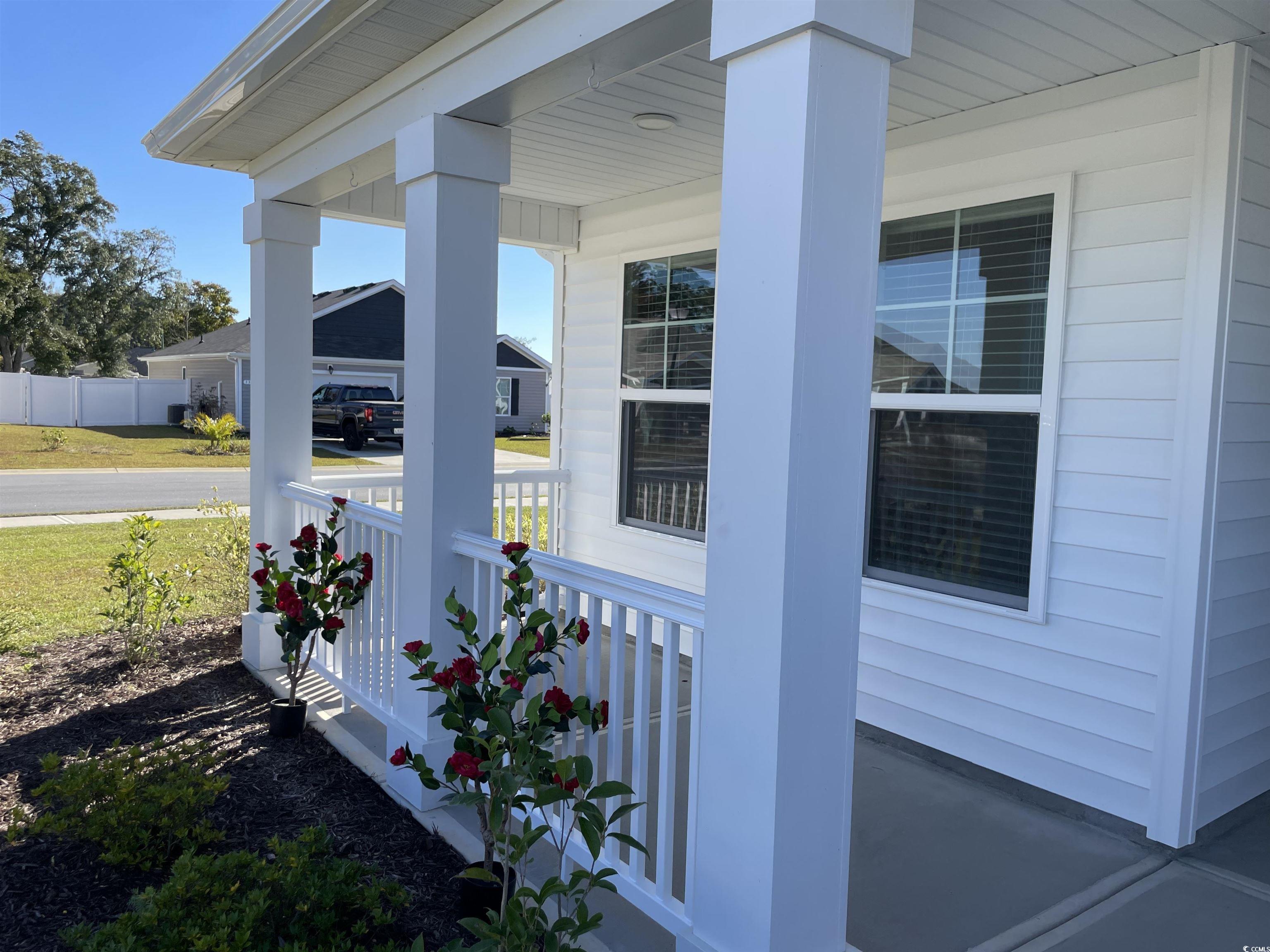 351 Jeff Waters Circle Longs, SC 29568 - Photo 3 of 33 View of side of property with covered porch