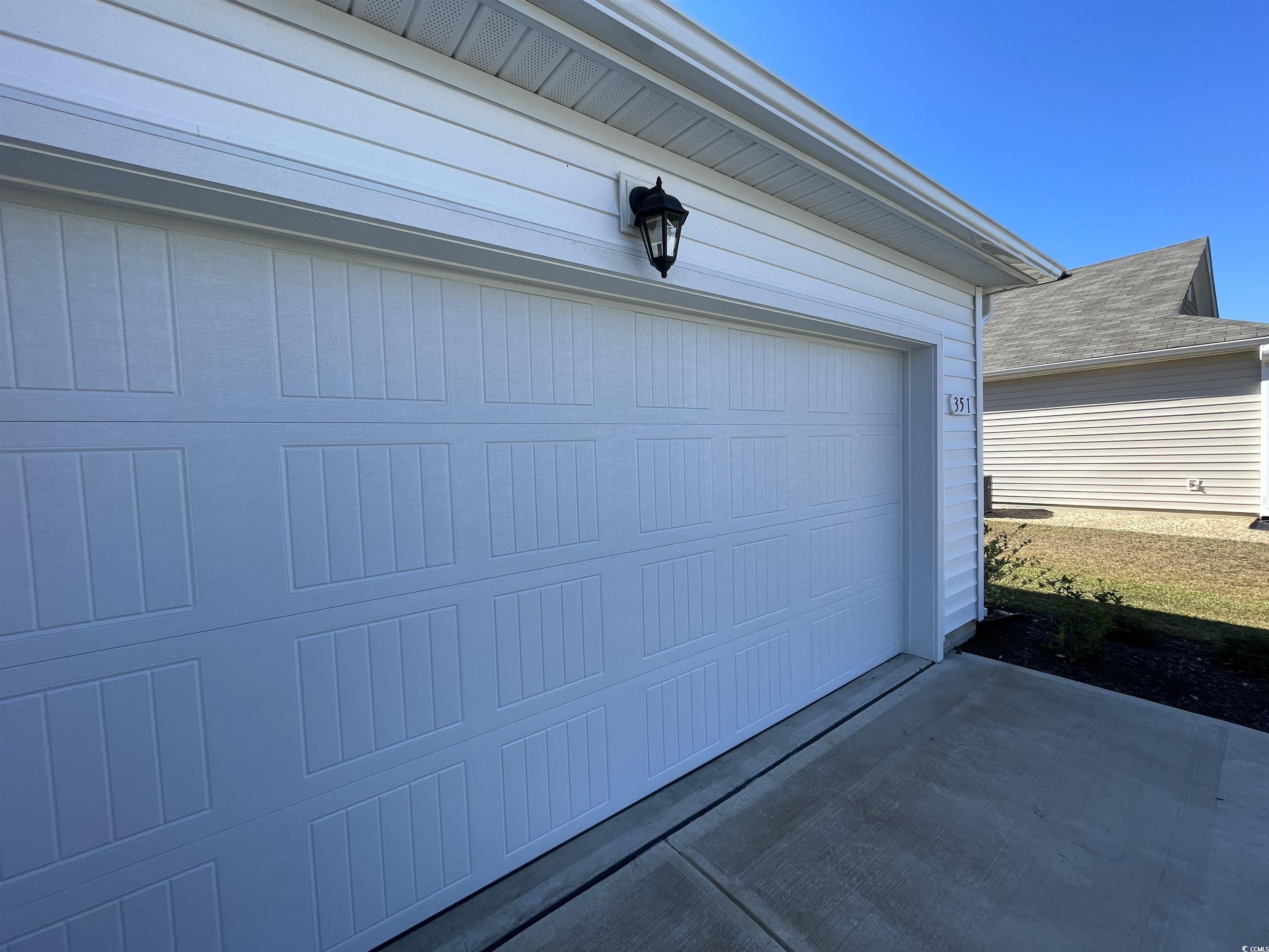 351 Jeff Waters Circle Longs, SC 29568 - Photo 6 of 33 Garage with driveway