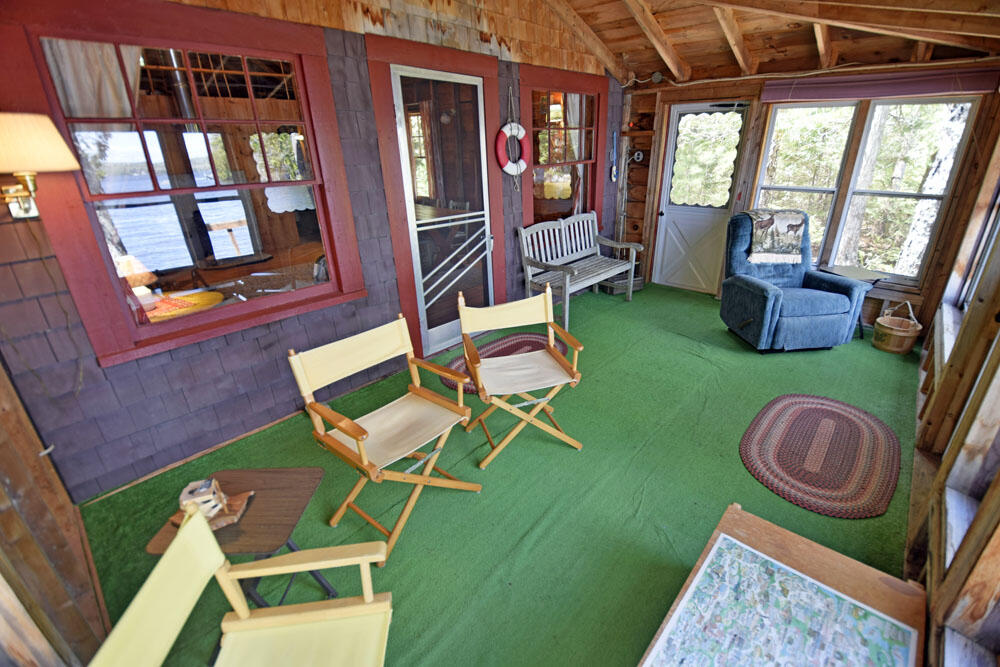 823 Macomber Mill Road Eastbrook, ME 04634 - Photo 25 of 57 glassed porch 2