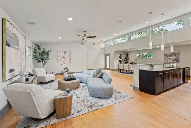 a backyard of a house with lots of green space and garden