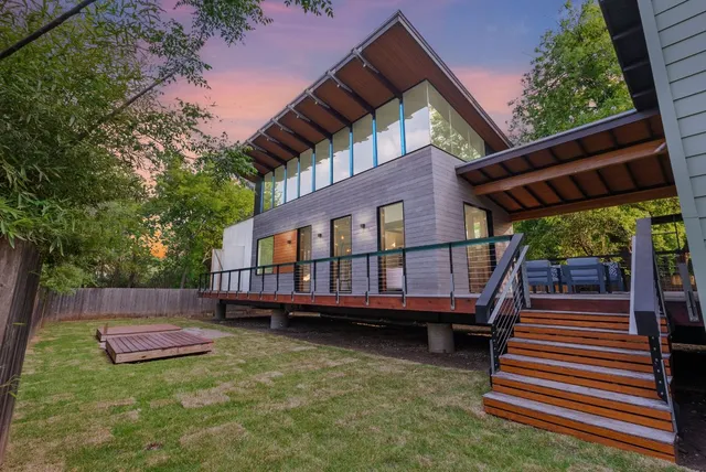a kitchen with stainless steel appliances a stove a microwave and cabinets
