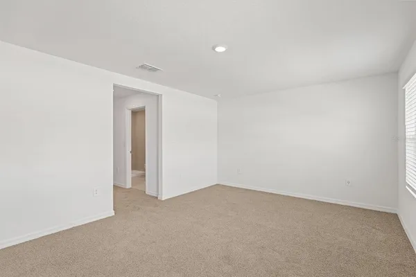 a utility room with cabinets washer and dryer