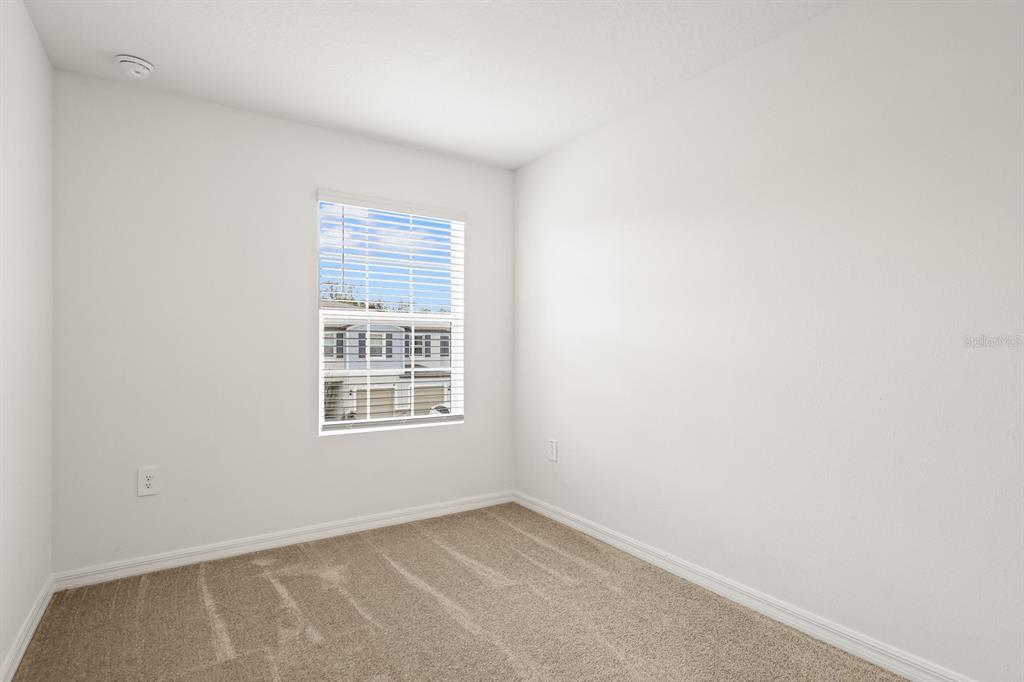 2642 Sunray Venus Way Ruskin, FL 33570 - Photo 21 of 30 a view of an empty room with a window
