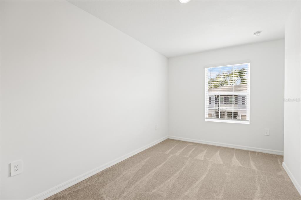 2642 Sunray Venus Way Ruskin, FL 33570 - Photo 24 of 30 a view of an empty room with a window