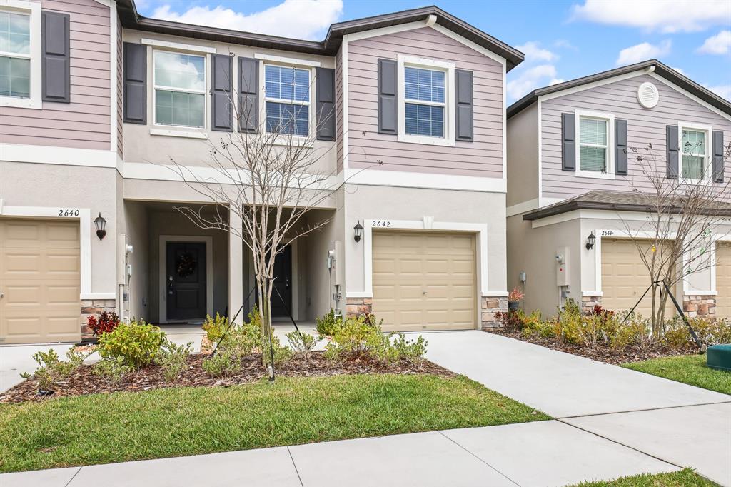 2642 Sunray Venus Way Ruskin, FL 33570 - Photo 29 of 30 front view of a house with a yard