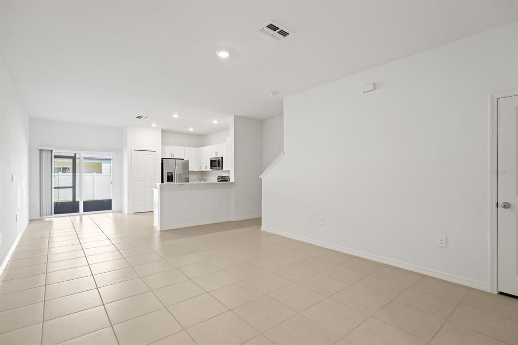 2642 Sunray Venus Way Ruskin, FL 33570 - Photo 5 of 30 a view of a kitchen with a sink and a refrigerator