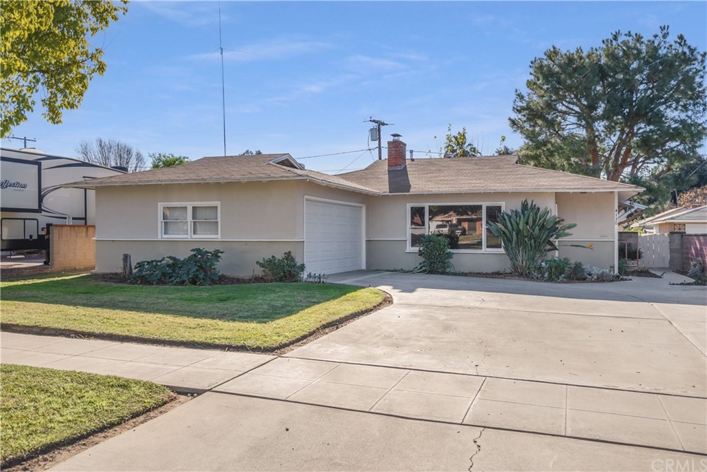 4130 Acacia Street Riverside, CA 92503 - Photo 1 of 1 a front view of a house with a yard