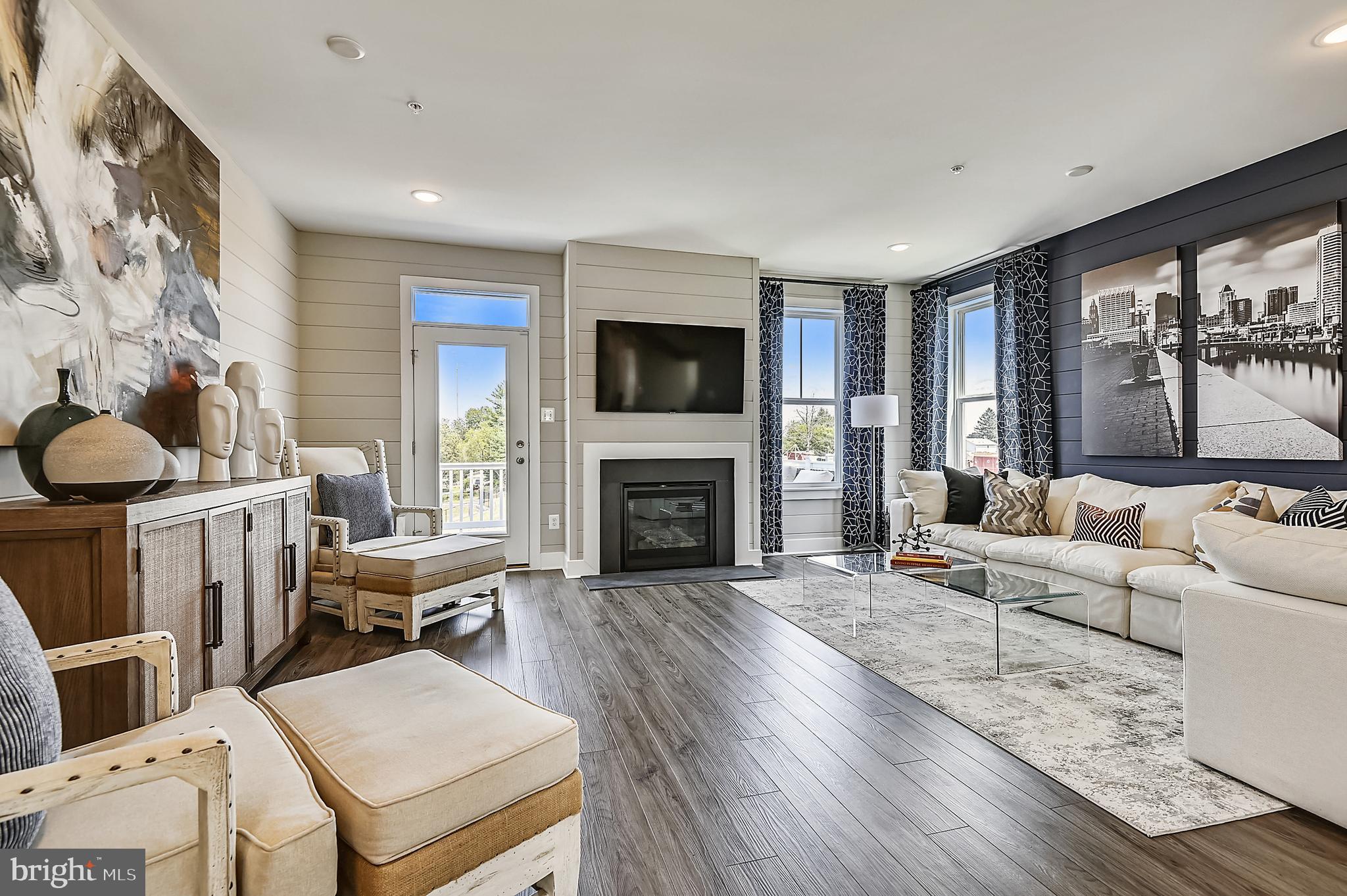 16601 Breezeway Alley Accokeek, MD 20607 - Photo 13 of 34 a living room with furniture a fireplace and a flat screen tv