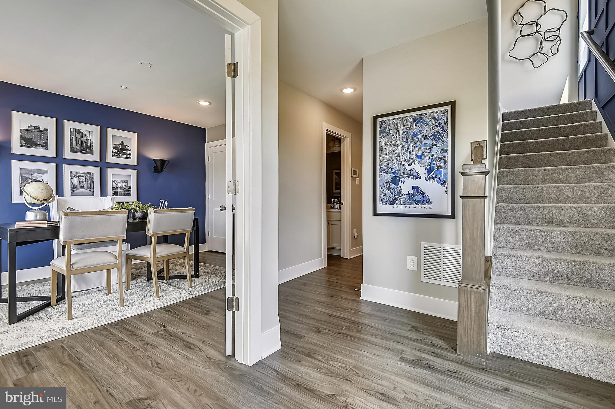 16601 Breezeway Alley Accokeek, MD 20607 - Photo 3 of 34 a view of a hallway with wooden floor and furniture