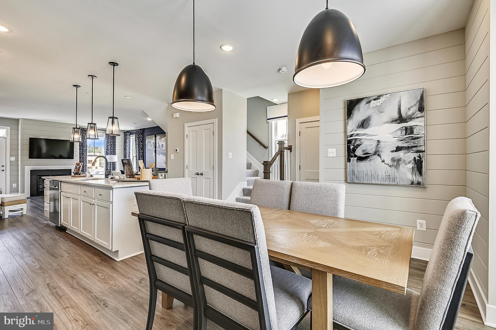 16601 Breezeway Alley Accokeek, MD 20607 - Photo 7 of 34 a kitchen with cabinets and chairs
