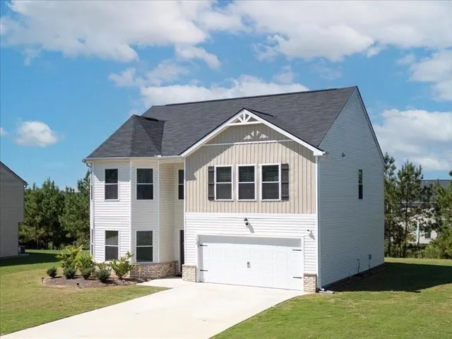 a front view of a house with a yard