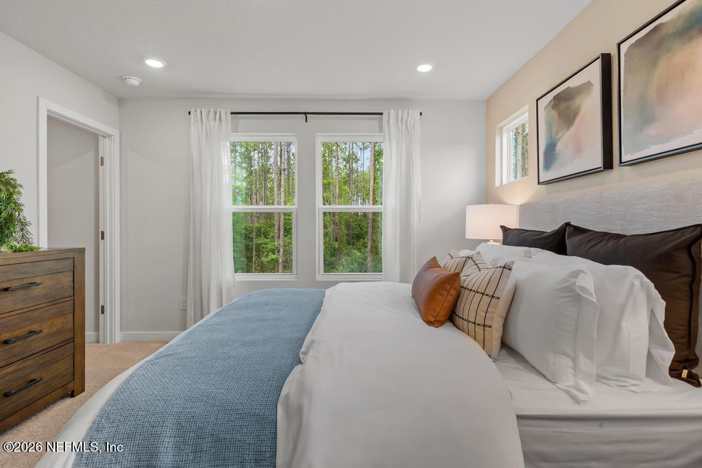 10698 Waterfield Road Jacksonville, FL 32210 - Photo 24 of 38 a bedroom with a bed and window