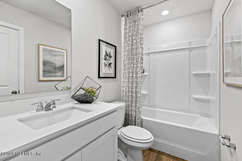 10698 Waterfield Road Jacksonville, FL 32210 - Photo 33 of 38 a bathroom with a sink toilet and shower
