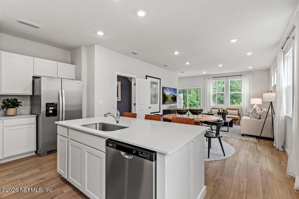 10698 Waterfield Road Jacksonville, FL 32210 - Photo 6 of 38 a view of kitchen with stainless steel appliances granite countertop a sink stove and refrigerator