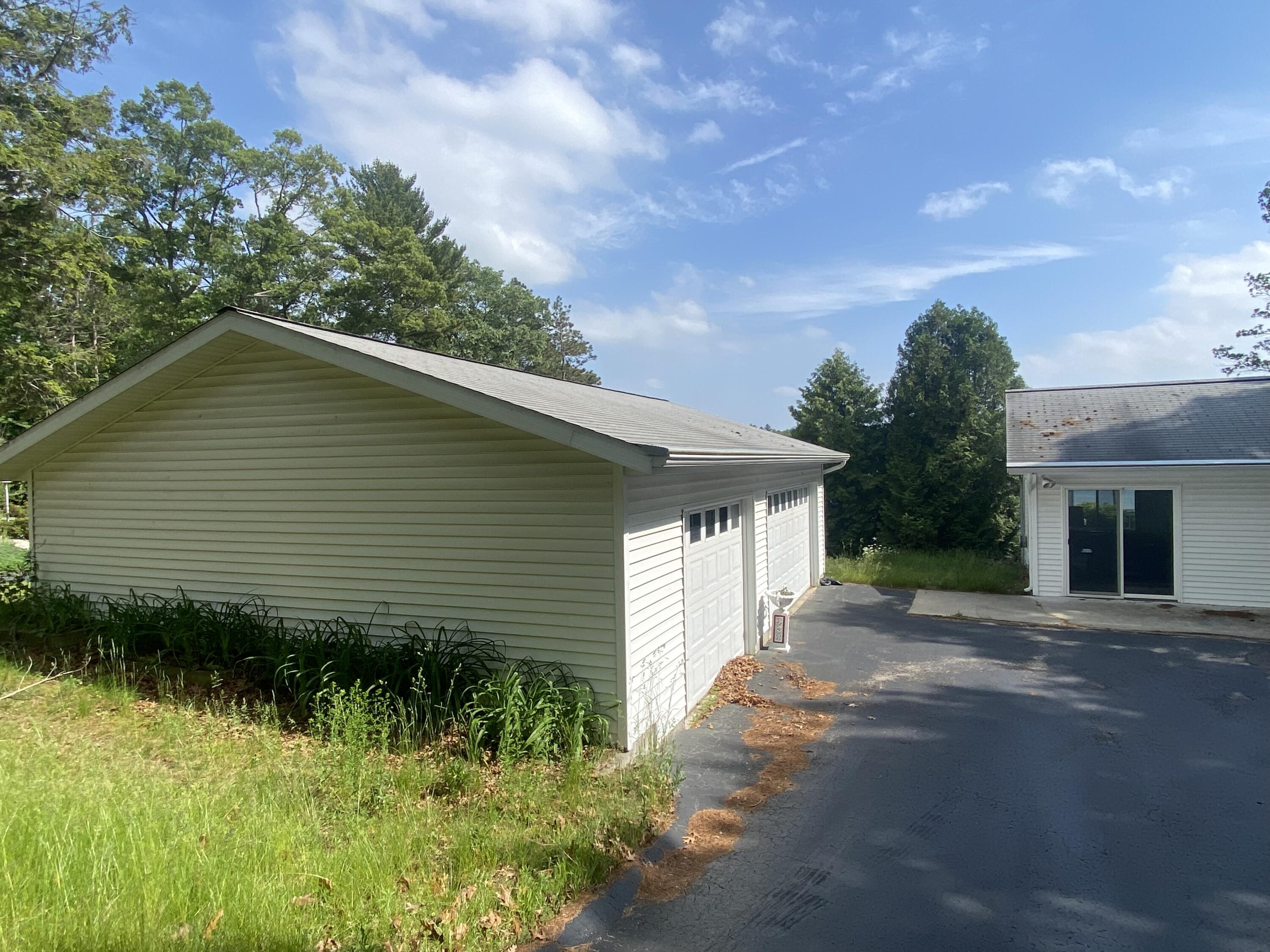 7 East Piney Road Manistee, MI 49660 - Photo 1 of 12 3 car detached garage