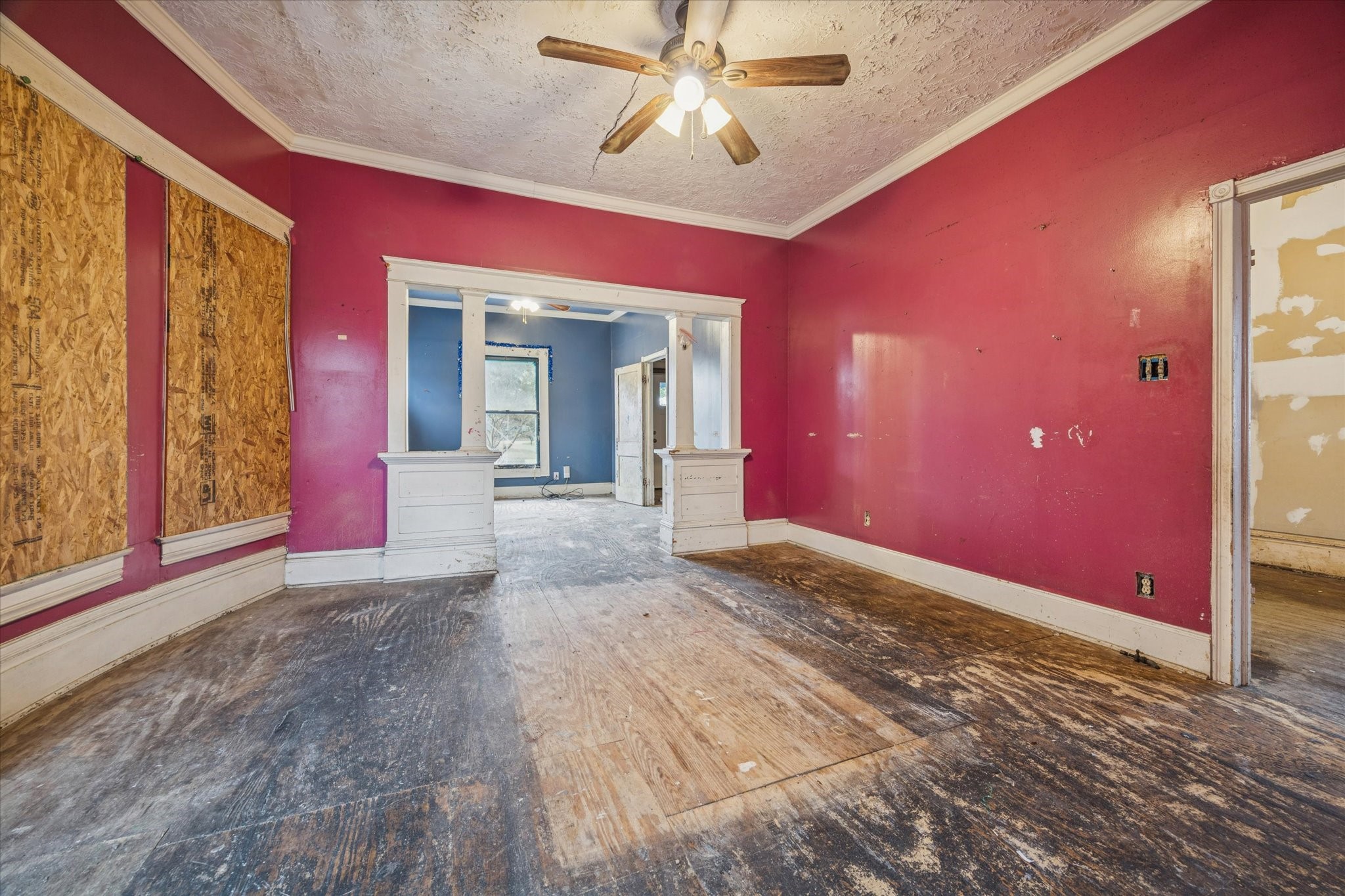 2906 Garrow Street Houston, TX 77003 - Photo 4 of 18 a view of a livingroom with a chandelier fan and windows