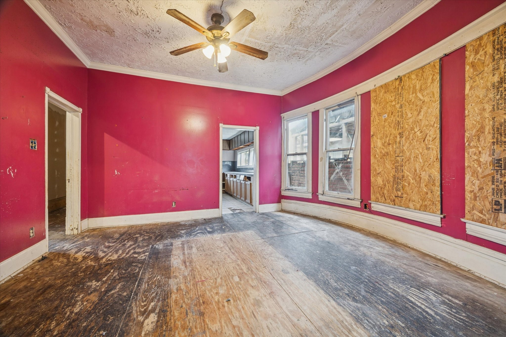 2906 Garrow Street Houston, TX 77003 - Photo 5 of 18 a view of an empty room with a window and wooden floor