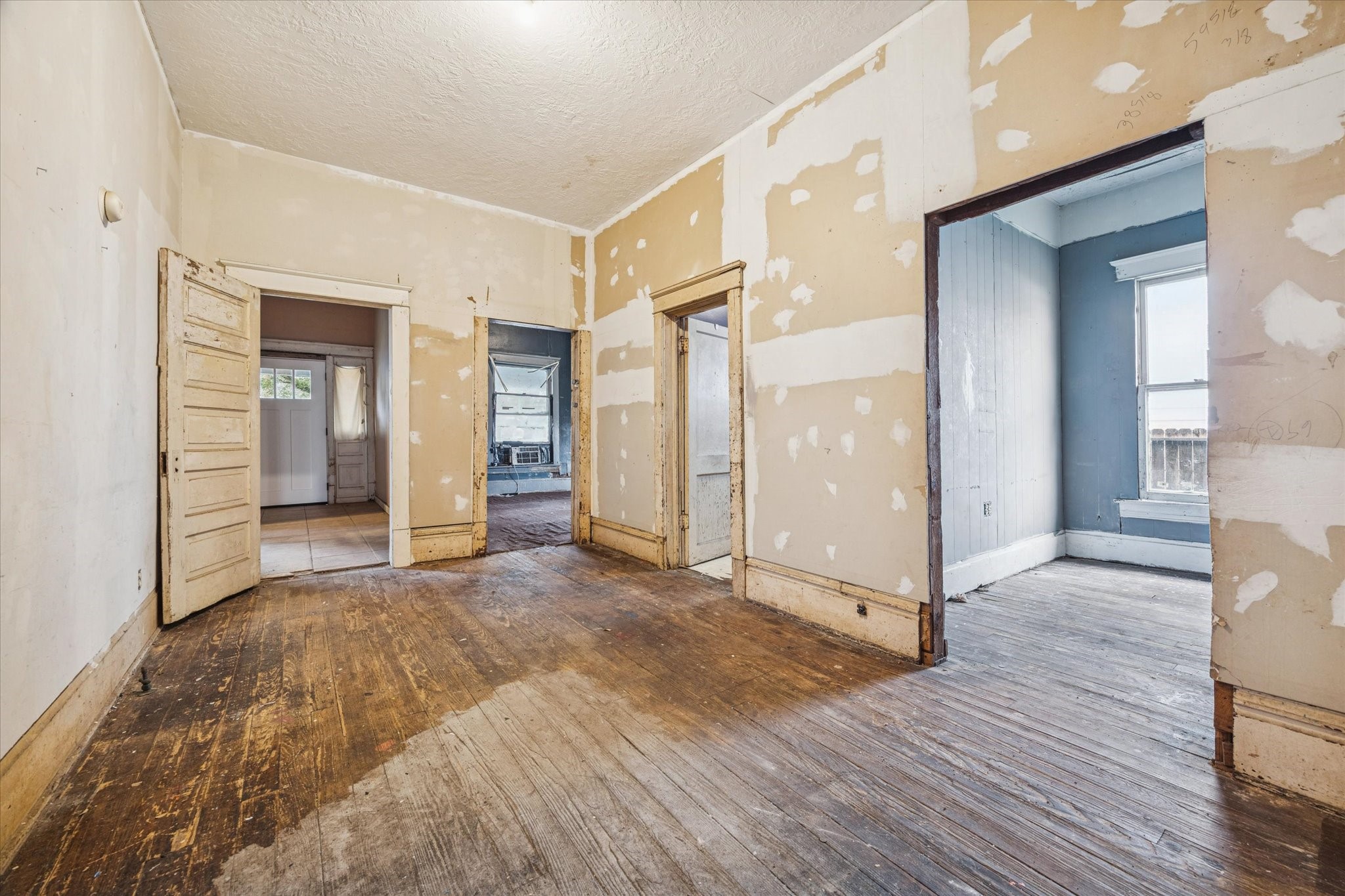 2906 Garrow Street Houston, TX 77003 - Photo 7 of 18 a view of a room with wooden floor and a bathroom