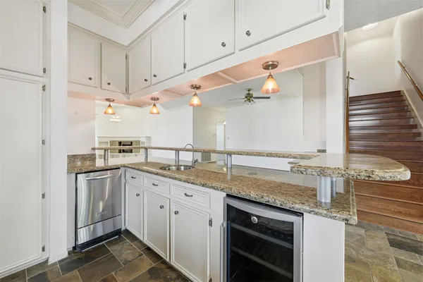 a kitchen with a sink and cabinets