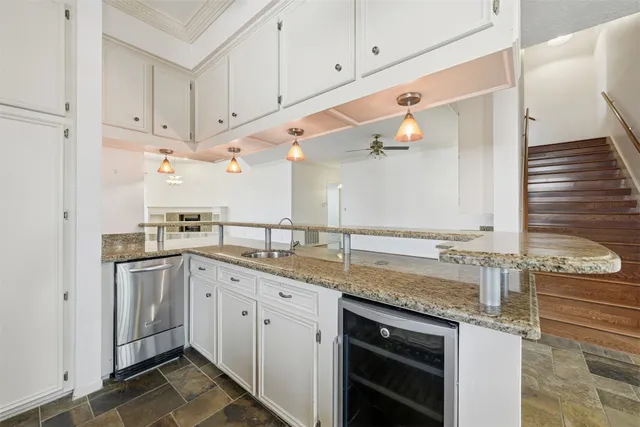 a kitchen with a sink and cabinets