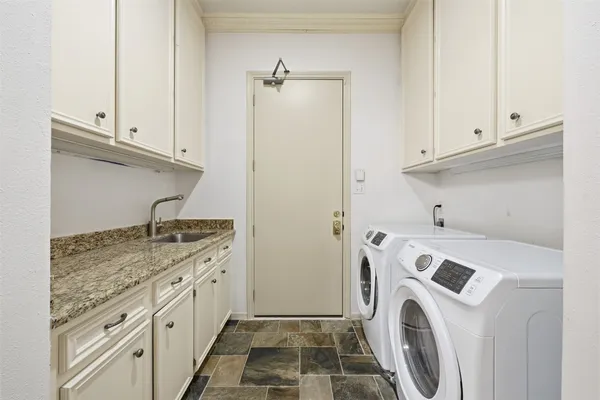 a view of a kitchen with washer and dryer