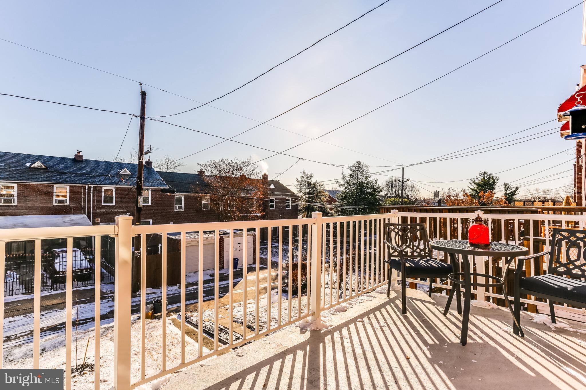 3909 Kimble Road Baltimore, MD 21218 - Photo 14 of 23 a view of a balcony with wooden floor