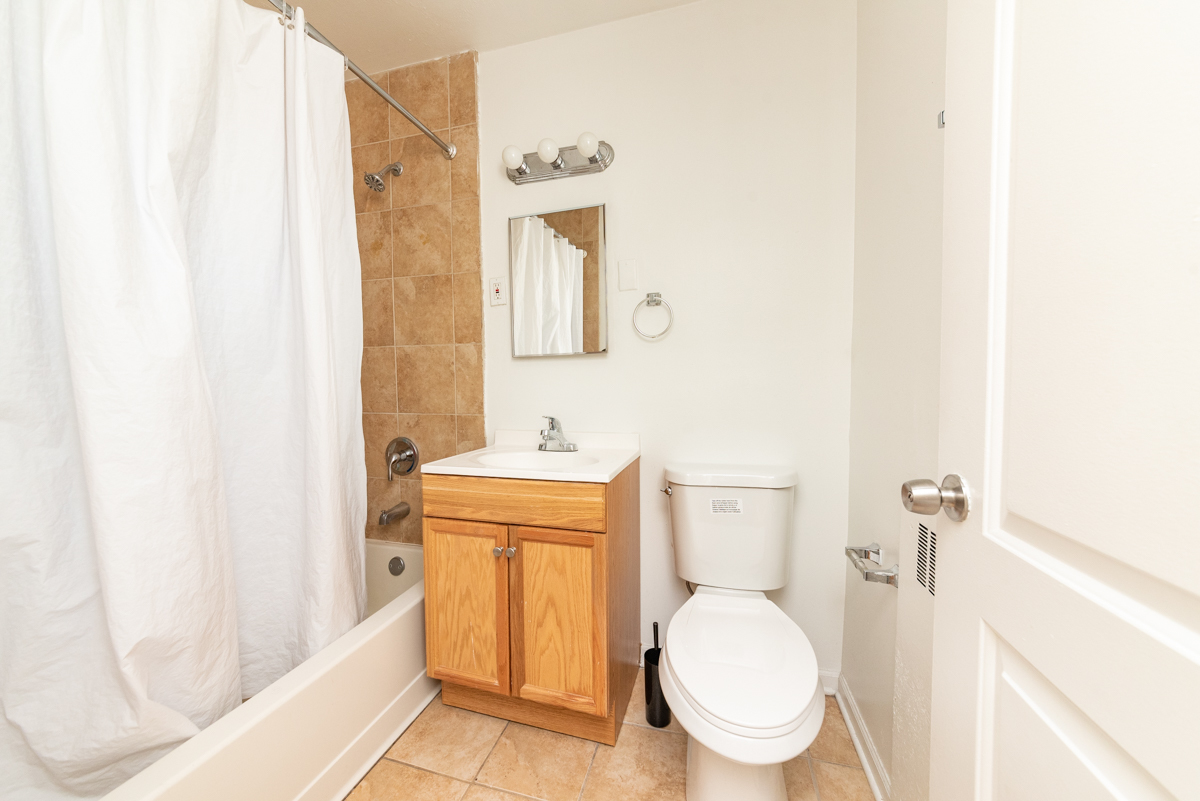 233 Custer Avenue, Unit 3 Evanston, IL 60202 - Photo 6 of 13 a bathroom with a sink and a toilet
