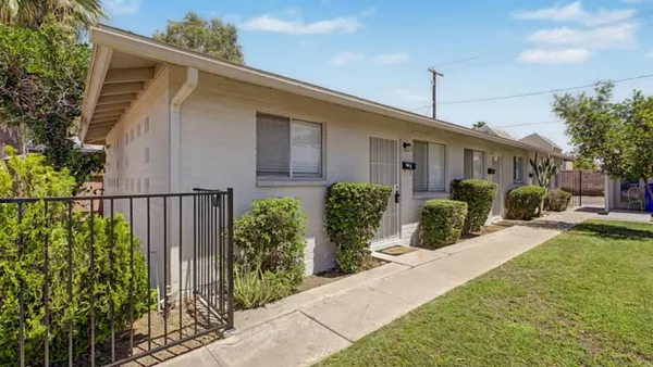 a front view of a house having yard