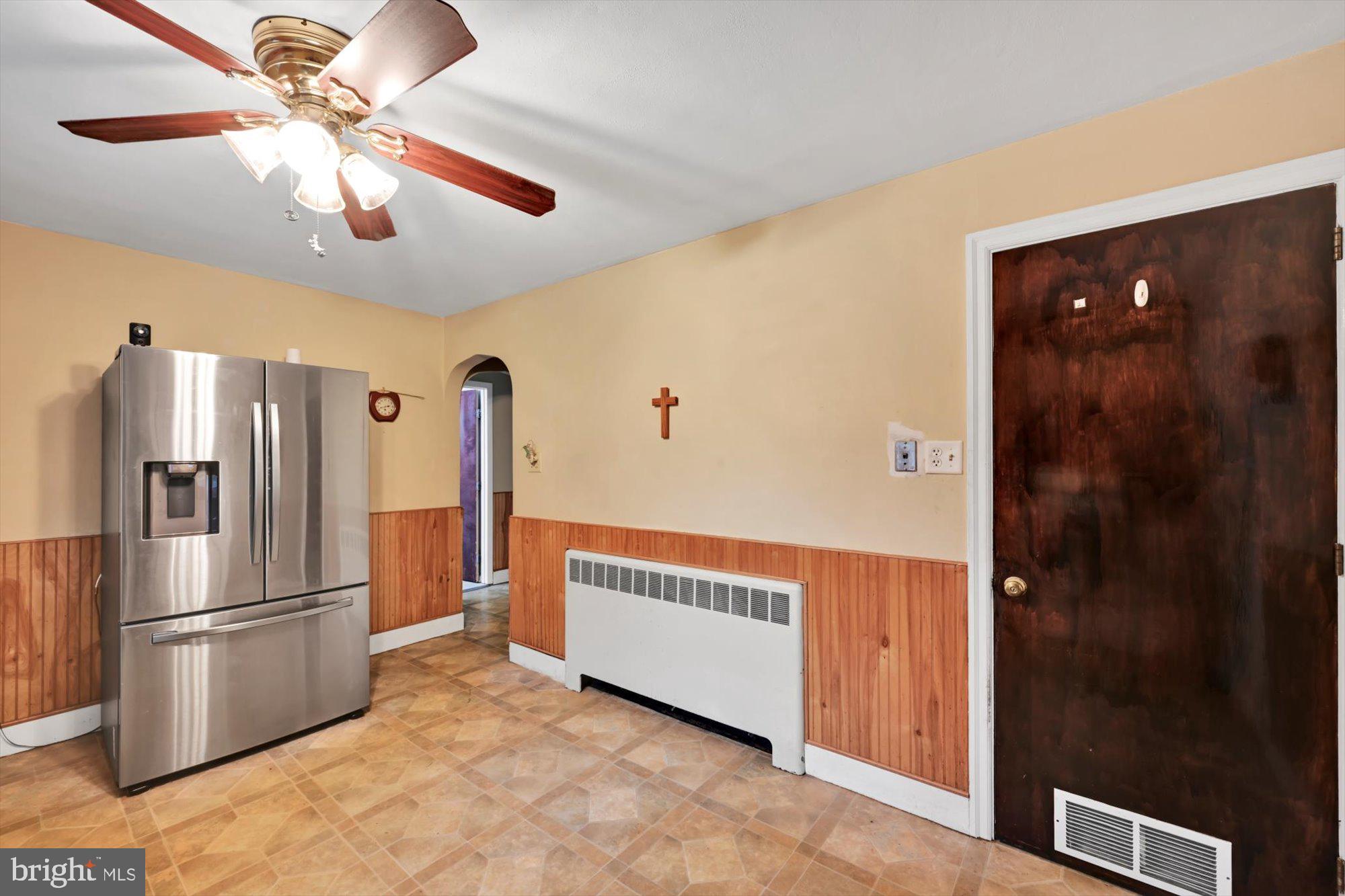 1130 Van Reed Road Reading, PA 19605 - Photo 13 of 39 a view of a hallway with a refrigerator and chandelier