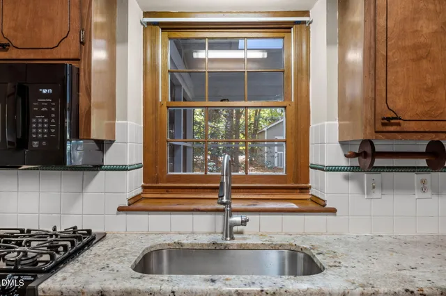 a kitchen with a sink and a window