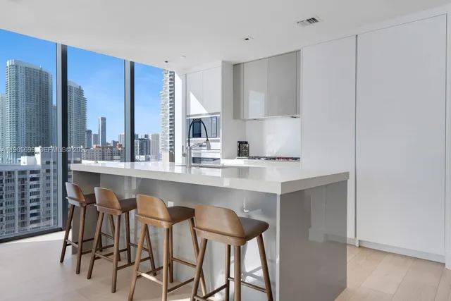 a kitchen with a sink cabinets and window