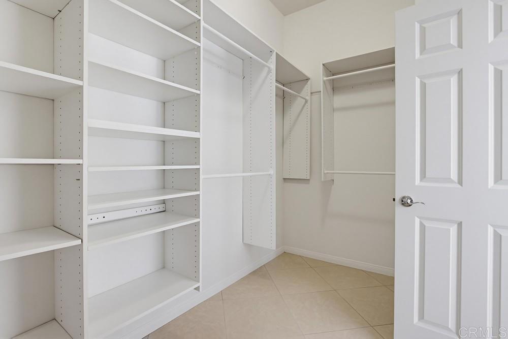 672 Inverlochy Drive Fallbrook, CA 92028 - Photo 40 of 75 a view of walk in closet with empty racks