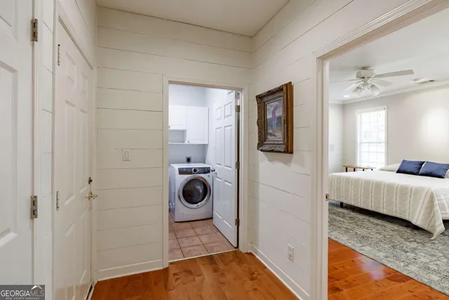 a utility room with sink dryer and washer