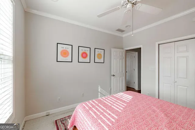 a bedroom with a bed and window