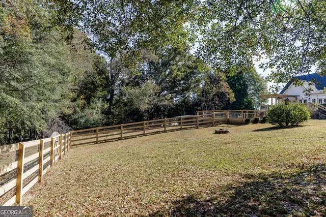 a view of outdoor space with deck and trees