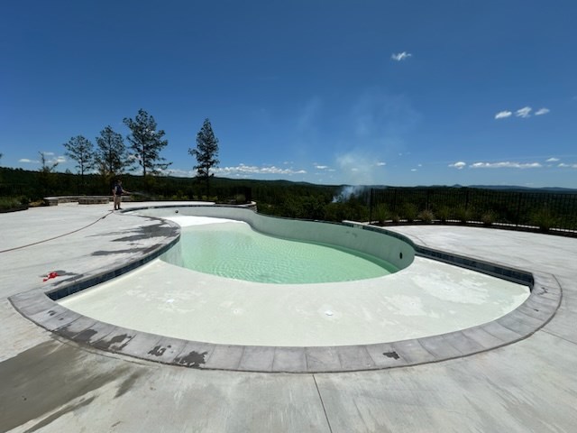 Undisclosed Address Talking Rock, GA 30175 - Photo 15 of 16 a view of a swimming pool with a yard