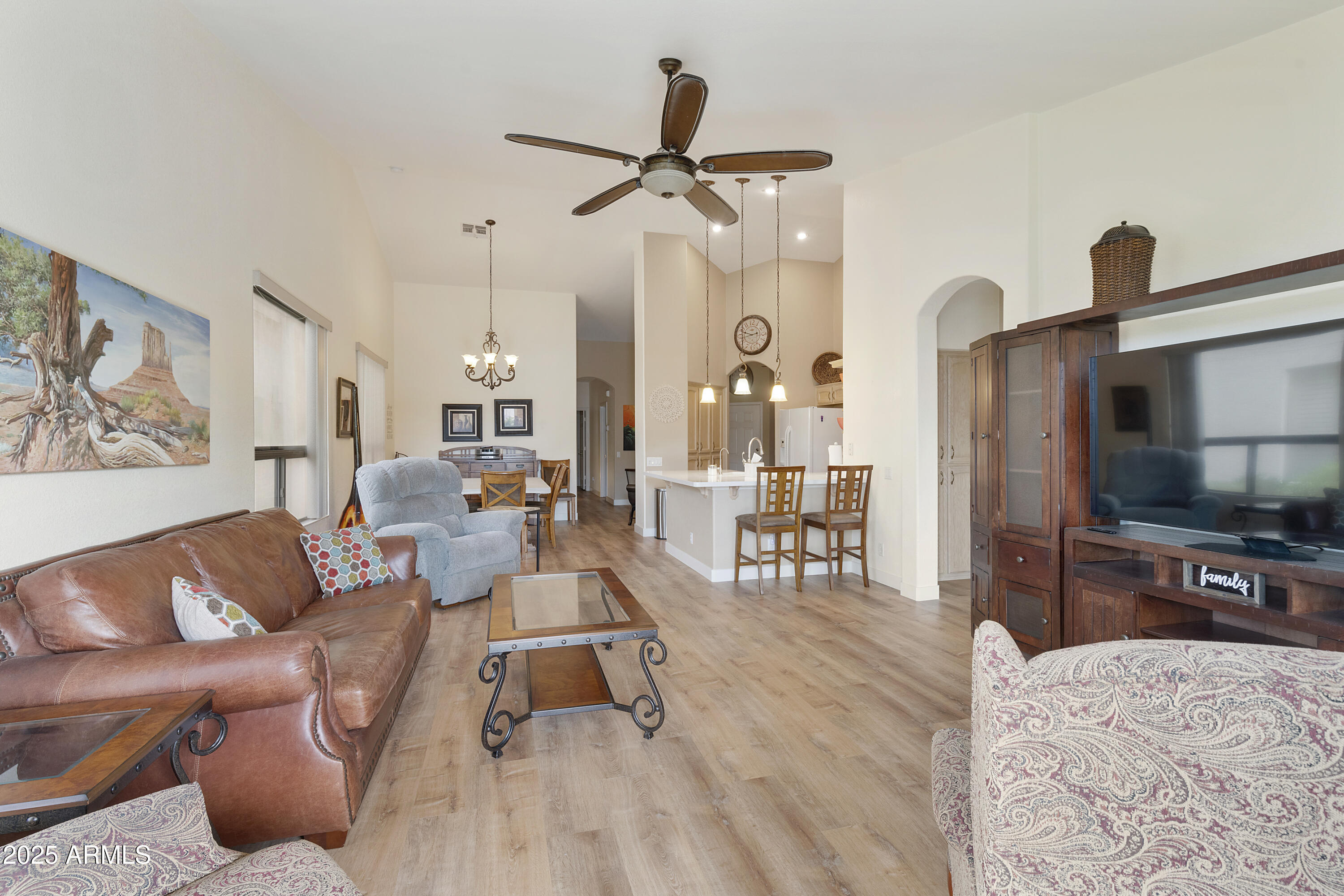23745 South Vacation Way Sun Lakes, AZ 85248 - Photo 7 of 52 a living room with furniture and a flat screen tv