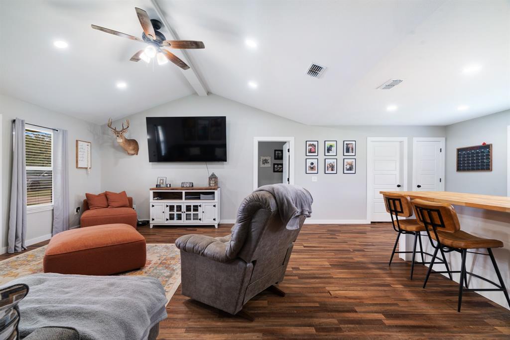 21 Private Road Paris, TX 75462 - Photo 7 of 15 Living room with dark wood-style floors, a ceiling fan, and recessed lighting