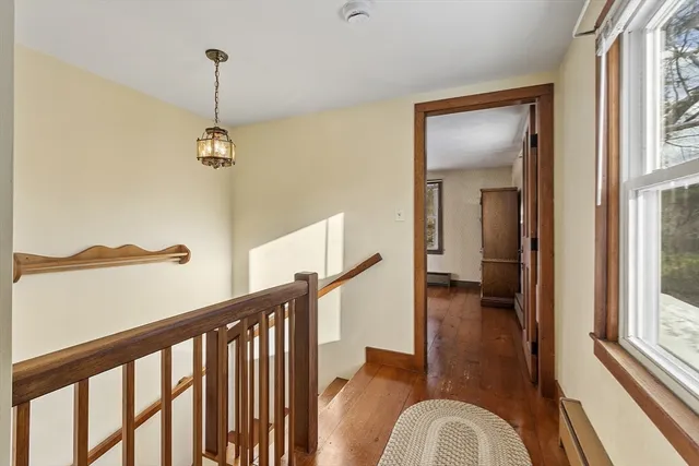 a view of a hallway with windows