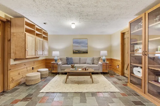 a living room with furniture and a table