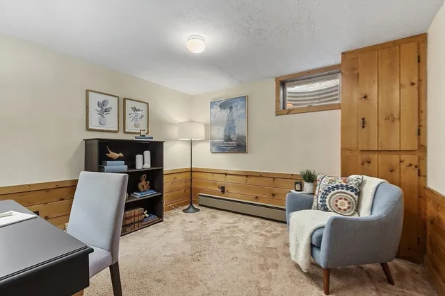 a bedroom with furniture and a wooden floor