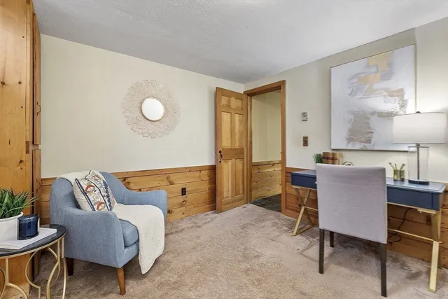 a living room with furniture and a chair