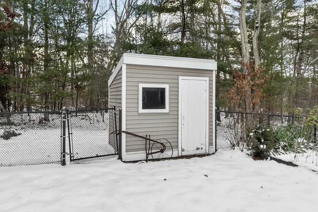 a view of a house with a snow in the yard