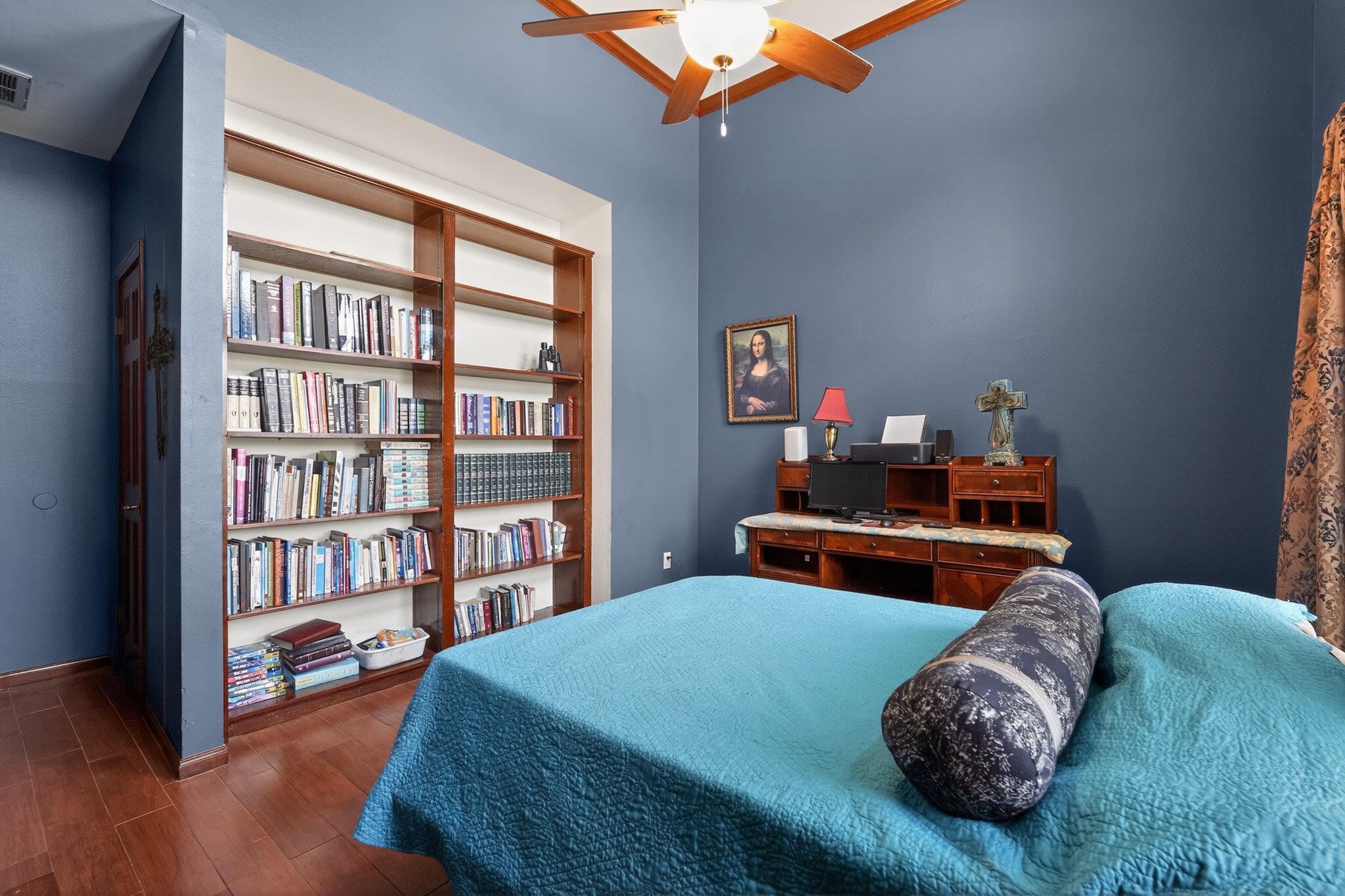 19027 Relay Road Humble, TX 77346 - Photo 20 of 29 First-floor bedroom featuring a custom built-in bookcase.