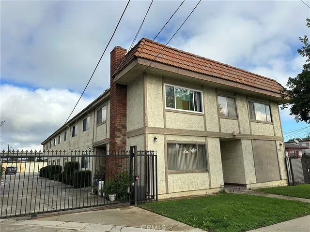a view of a house with a large window and stairs